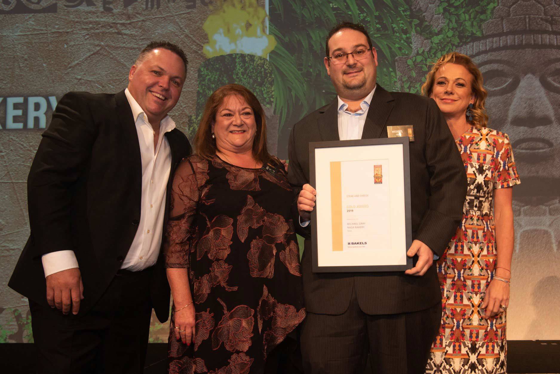 Peter Gray and his wife Judith accepting an award